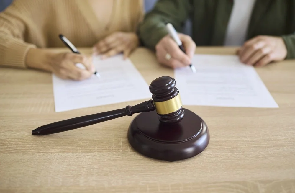 Couple signing paper